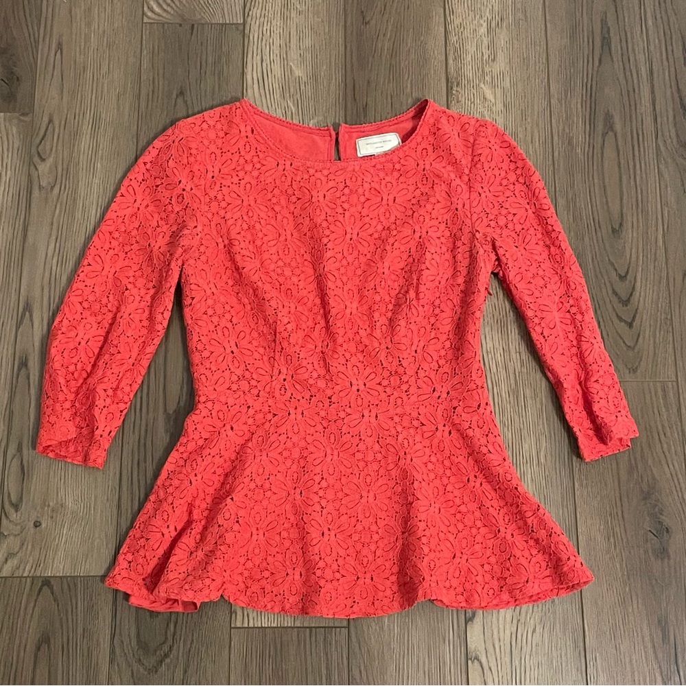 Anthropologie Moulinette Soeurs lace peplum blouse in a coral or orange color